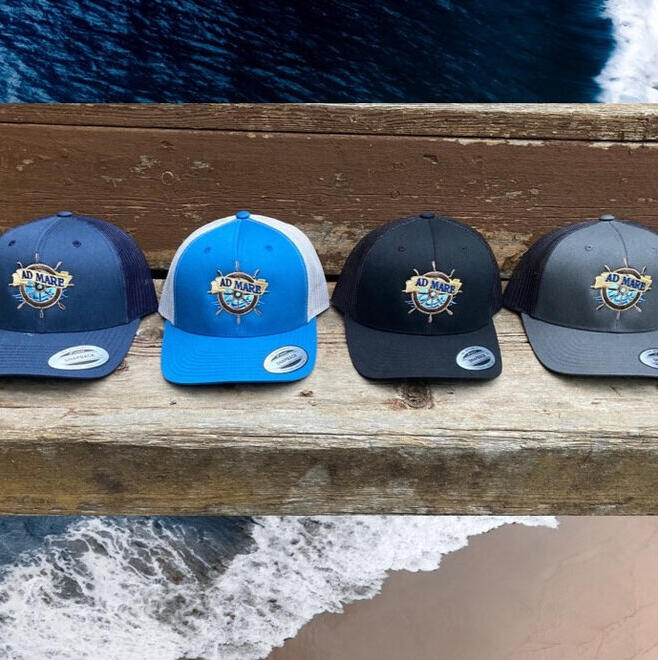 Four retro hats with embroidered Ad Mare logo